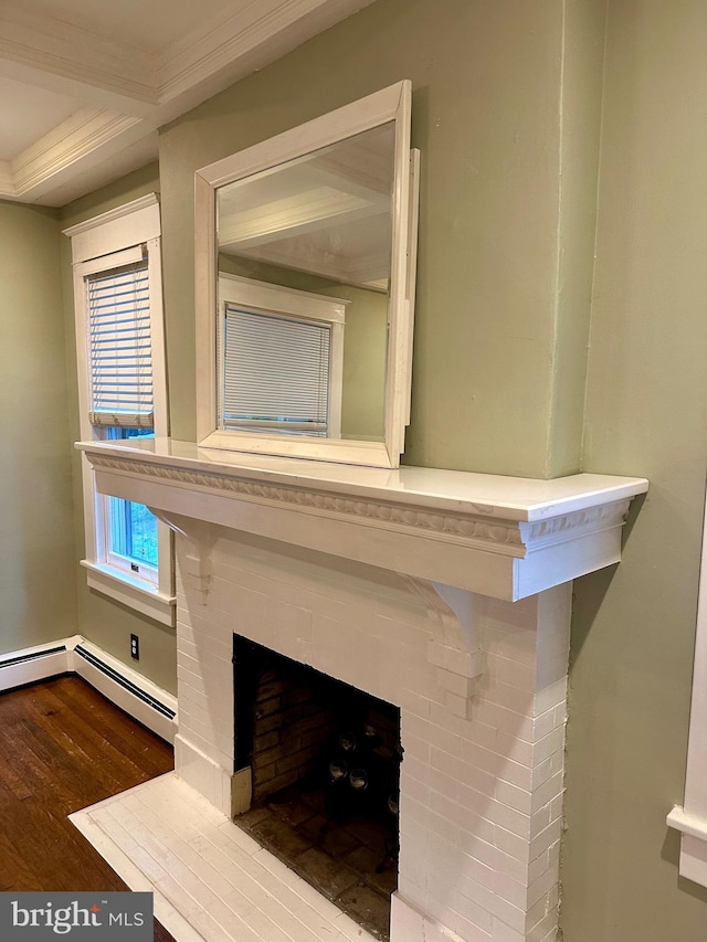 room details featuring hardwood / wood-style floors, baseboard heating, and a fireplace