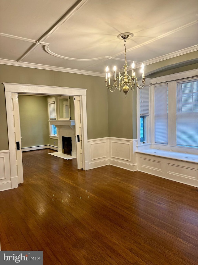 unfurnished dining area featuring crown molding, dark wood-type flooring, and a chandelier