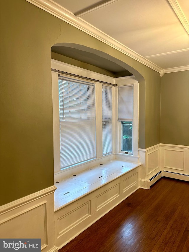 interior space featuring dark hardwood / wood-style floors, a healthy amount of sunlight, and crown molding