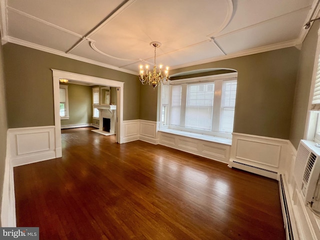 unfurnished dining area with dark hardwood / wood-style flooring, plenty of natural light, a chandelier, and a baseboard heating unit