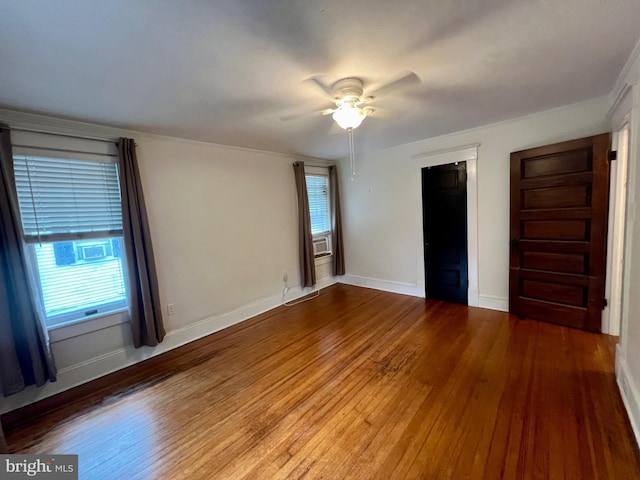 unfurnished bedroom with ceiling fan and hardwood / wood-style floors