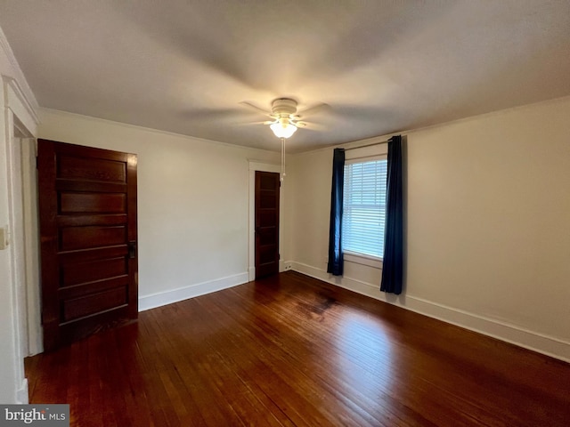 unfurnished bedroom with ceiling fan and dark wood-type flooring