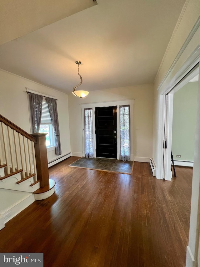 entryway with dark wood-type flooring and a baseboard heating unit