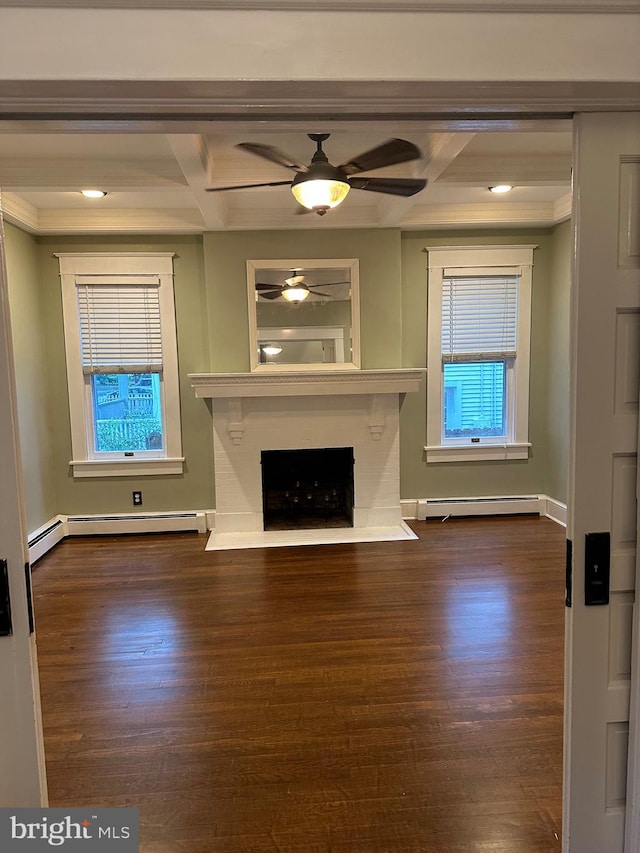 unfurnished living room with dark wood-type flooring, beamed ceiling, a baseboard radiator, and coffered ceiling