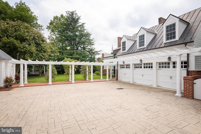 garage featuring a lawn