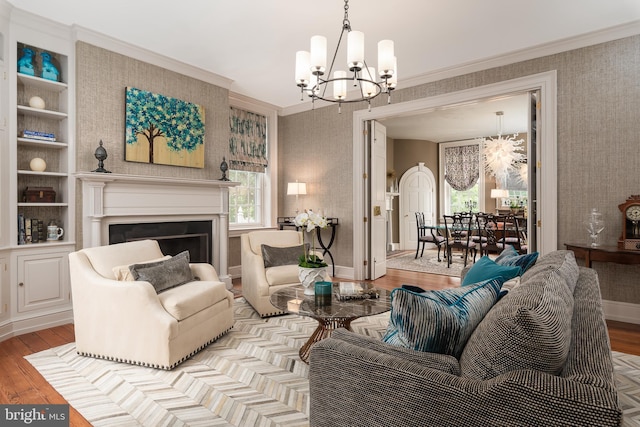 living room with light wood-type flooring and crown molding