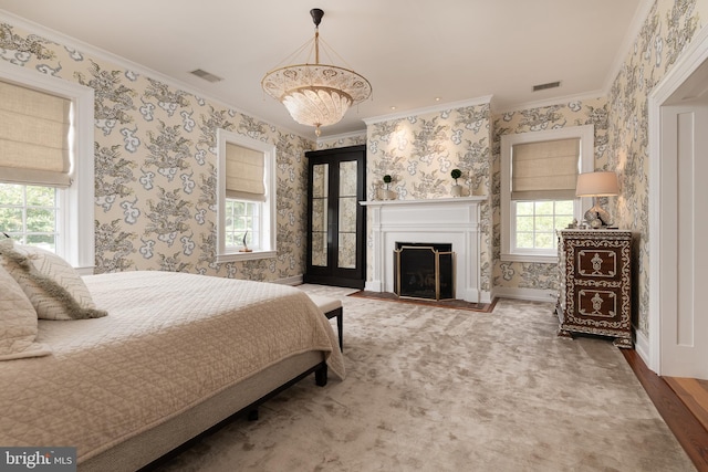 bedroom featuring wood-type flooring, ornamental molding, and a notable chandelier