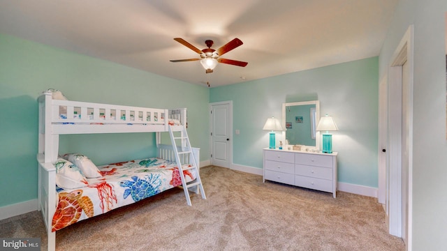 bedroom with light carpet and ceiling fan