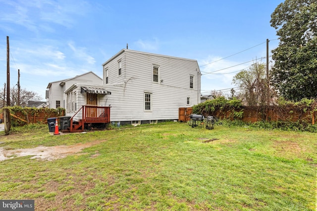 back of property featuring a lawn