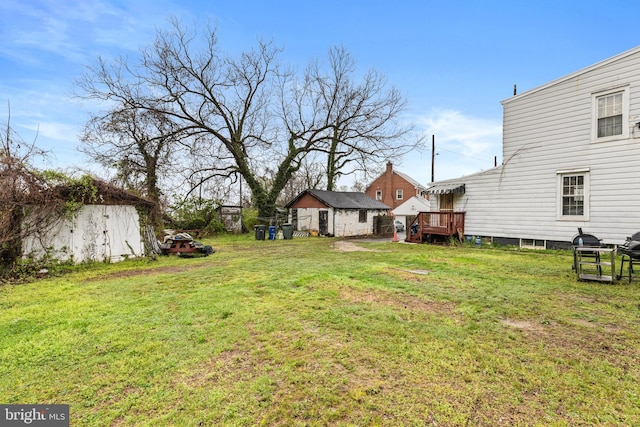 view of yard featuring a deck