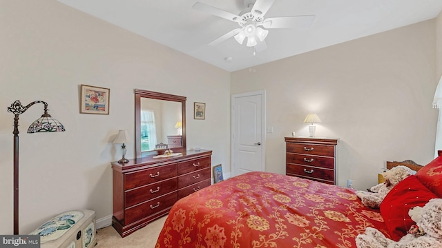 bedroom with ceiling fan and light colored carpet