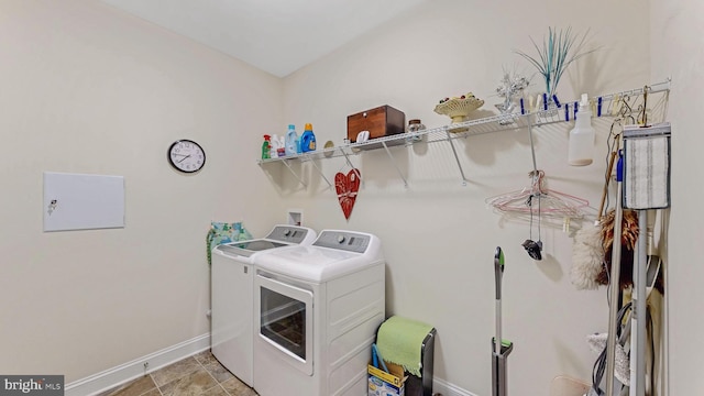 laundry room with washing machine and clothes dryer