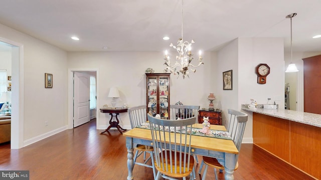 dining room featuring a chandelier and dark hardwood / wood-style flooring