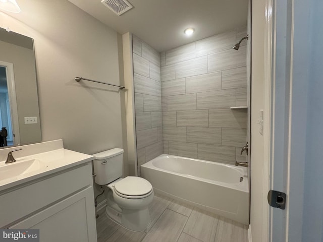 full bathroom with toilet, shower / washtub combination, vanity, and visible vents