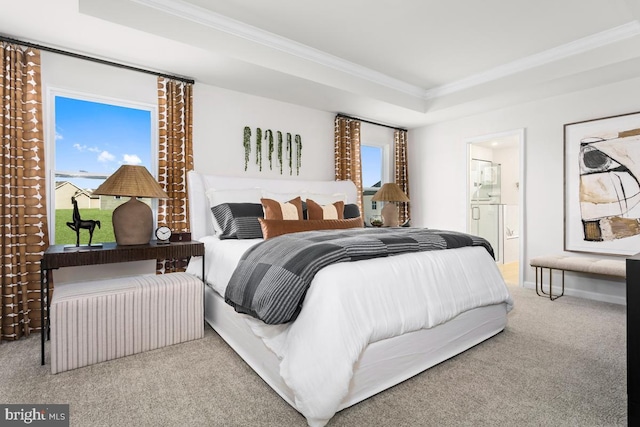 bedroom with light carpet, baseboards, a raised ceiling, ensuite bath, and ornamental molding