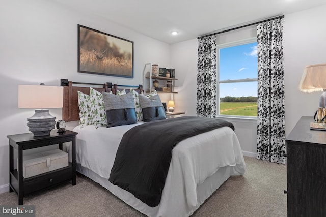 bedroom with recessed lighting, light colored carpet, and baseboards