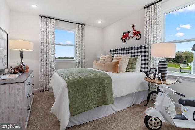 bedroom featuring recessed lighting and light carpet