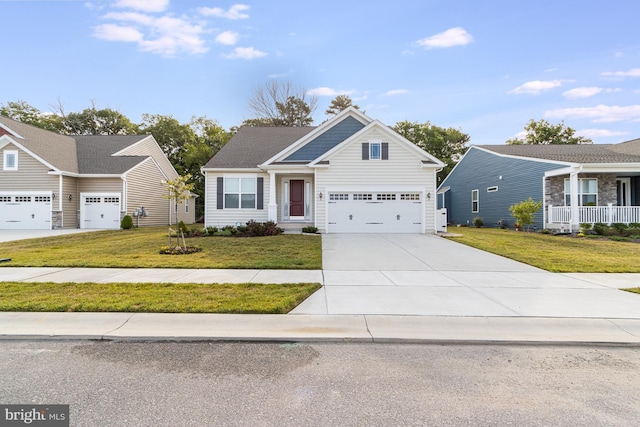 view of front of property with a garage and a front yard