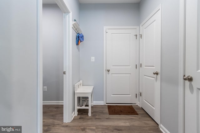 corridor featuring dark wood-type flooring