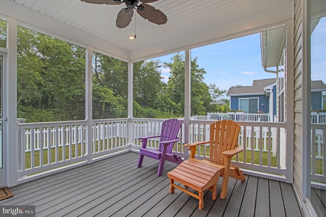 sunroom / solarium featuring ceiling fan