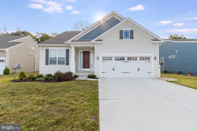 view of front of property with a front lawn and a garage