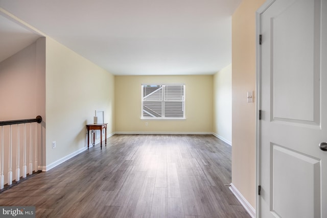 spare room with dark hardwood / wood-style floors