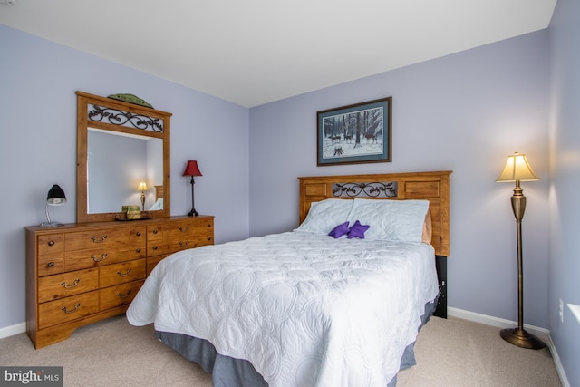 bedroom with light carpet