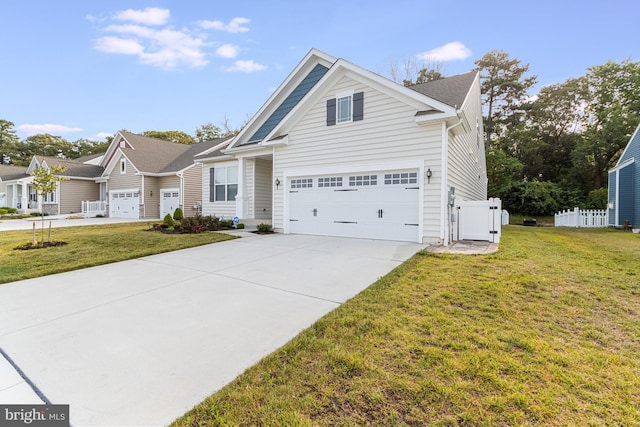 view of front of home with a front yard and a garage