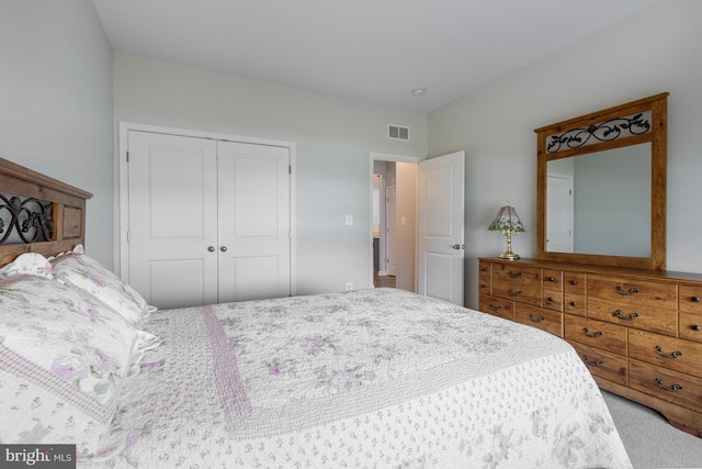 carpeted bedroom with a closet