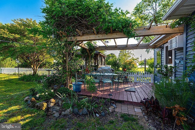 wooden deck featuring a lawn and a pergola