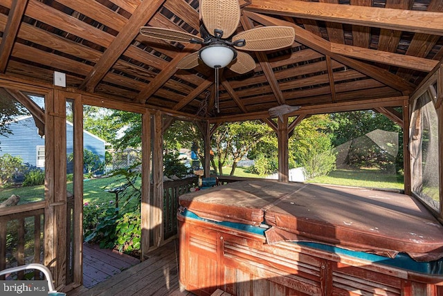 deck featuring a gazebo, a hot tub, and ceiling fan