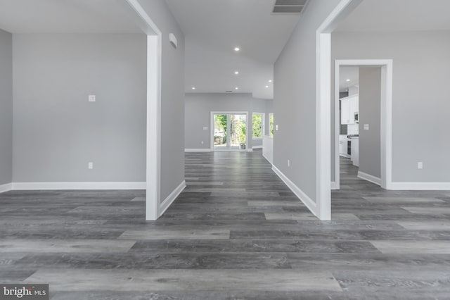 corridor with dark wood-type flooring