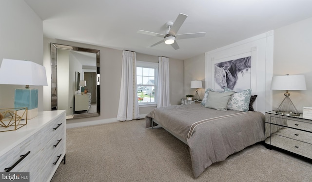 bedroom featuring ceiling fan and light colored carpet