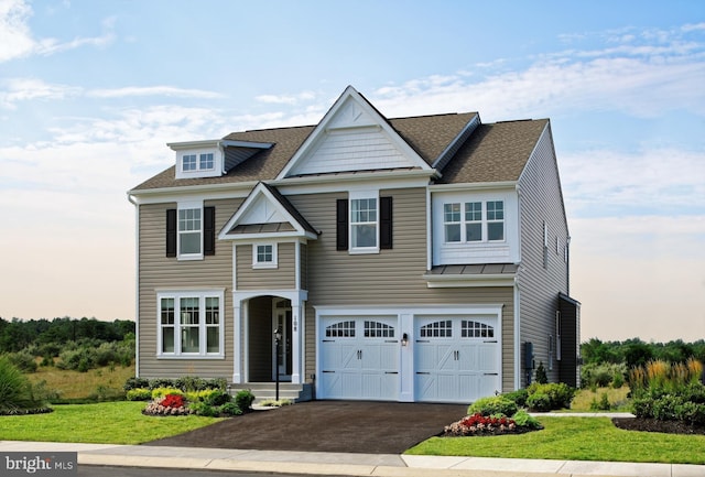 view of front facade featuring a lawn and a garage