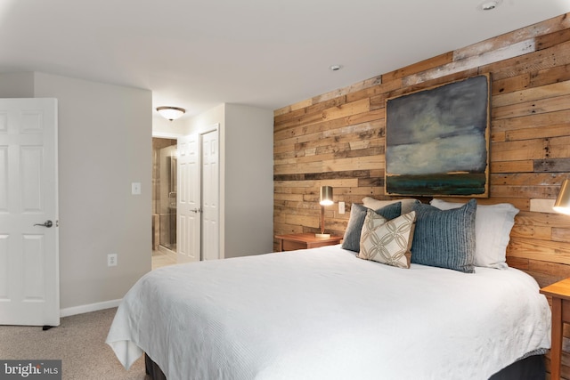 carpeted bedroom with wooden walls