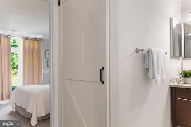 bathroom featuring vanity and crown molding