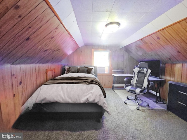 bedroom with lofted ceiling, carpet floors, and wooden walls