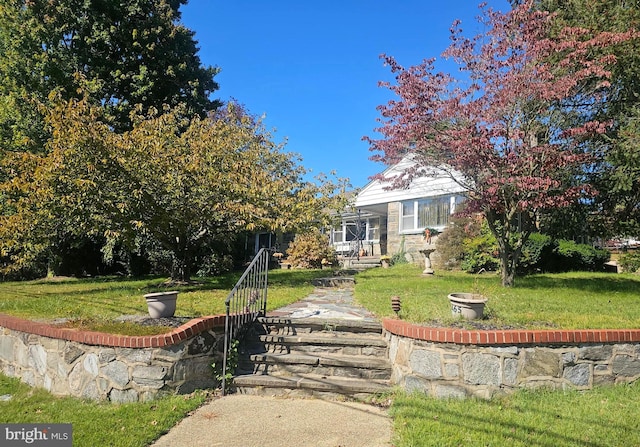 view of front of home with a front lawn