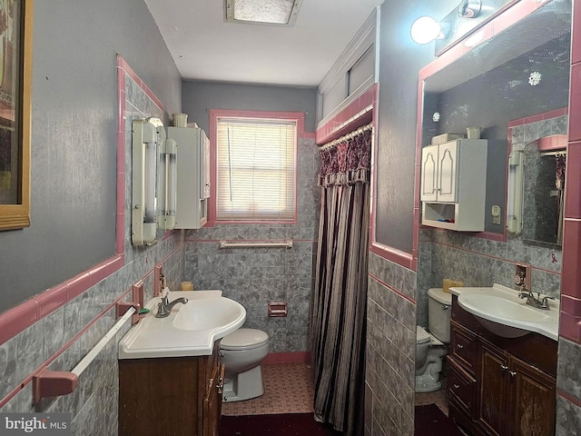 bathroom featuring vanity, tile patterned flooring, decorative backsplash, toilet, and tile walls