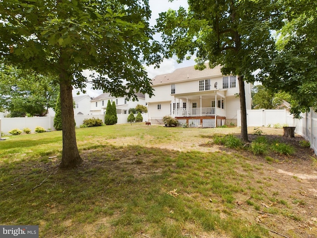 view of yard featuring a wooden deck