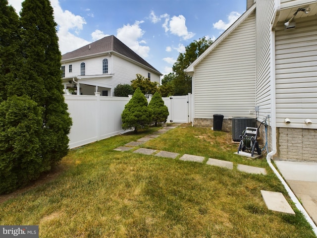 view of yard featuring central AC unit