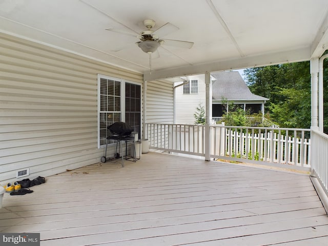 wooden deck with ceiling fan