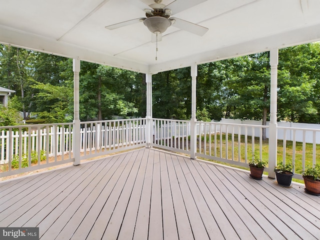 wooden terrace featuring ceiling fan