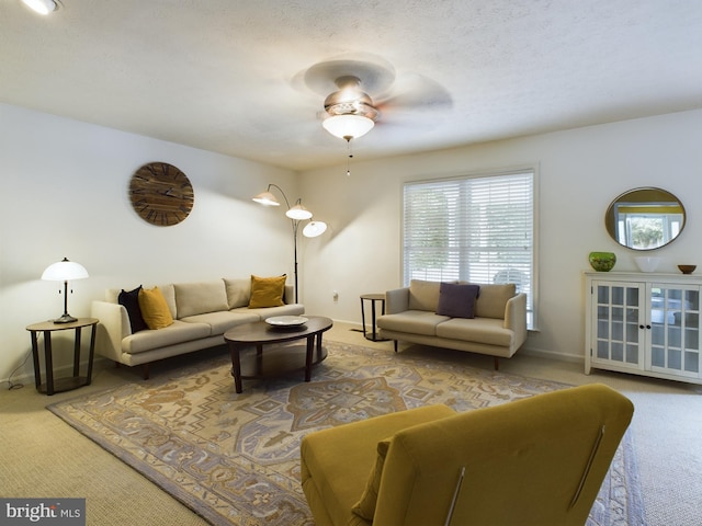 living room with carpet flooring and ceiling fan