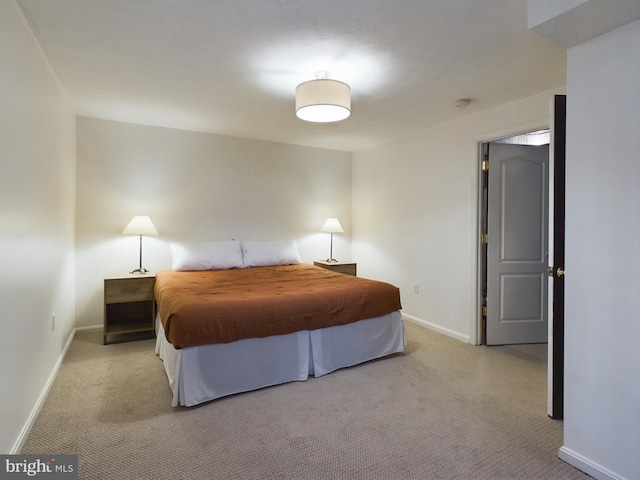 bedroom with light colored carpet