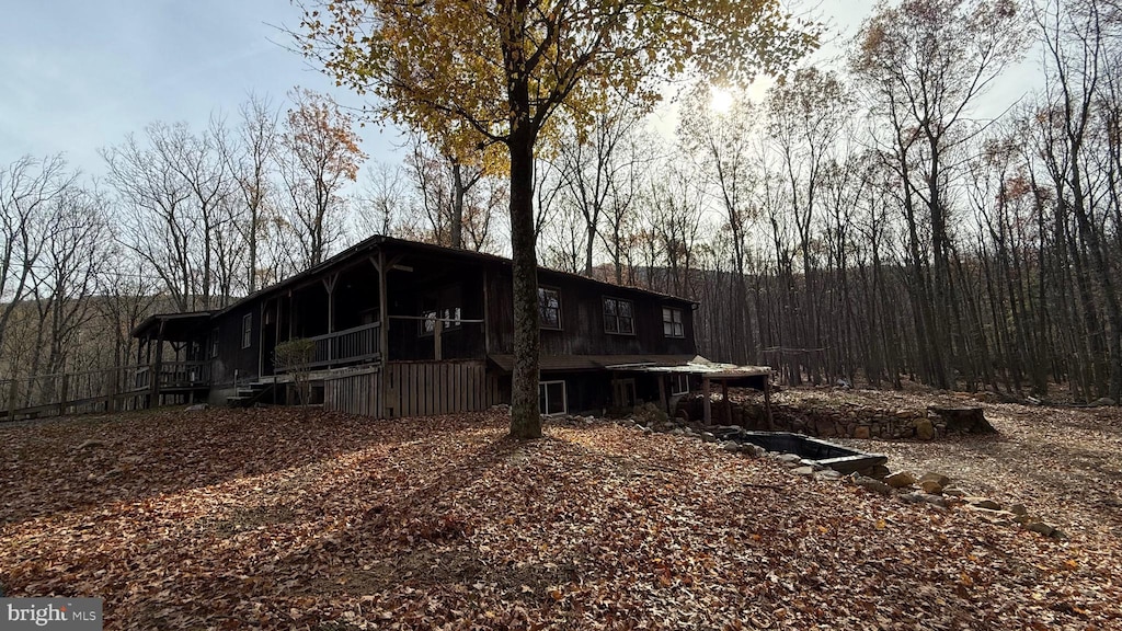 back of house with a sunroom