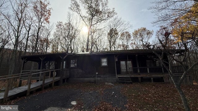 back of house with covered porch