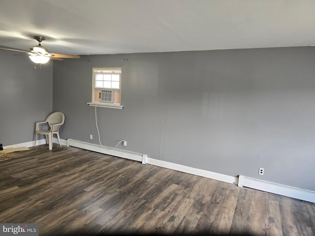 spare room featuring cooling unit, ceiling fan, wood-type flooring, and a baseboard heating unit