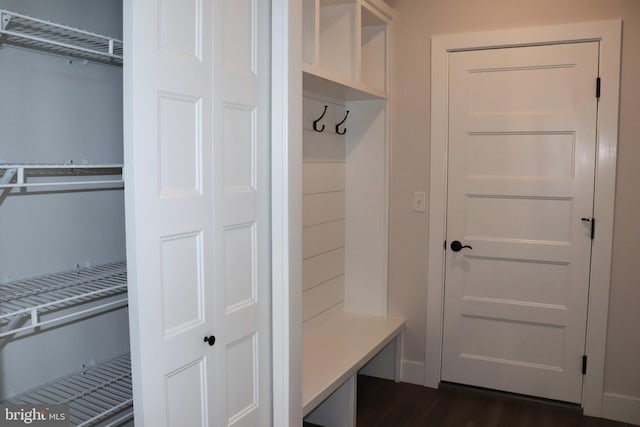 mudroom with dark wood-type flooring