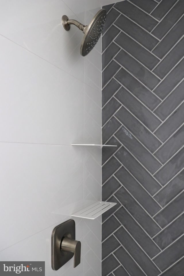 bathroom with tiled shower